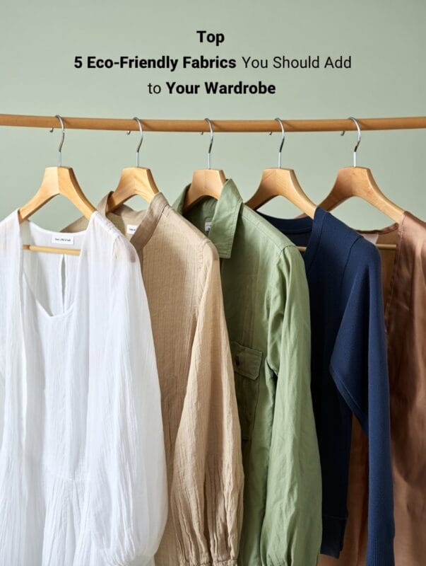 Eco-friendly clothing made from sustainable fabrics like organic cotton, hemp, linen, and Tencel hanging neatly on wooden hangers.
